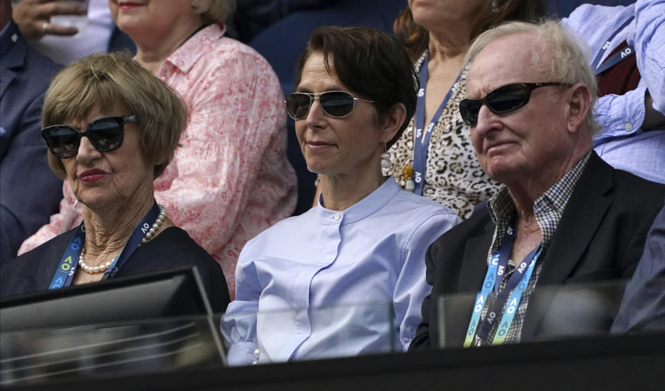 Former Australian Open champions, Margaret Court, left, and Rod Laver, right, watch the fourth round singles match between Serbia's Novak Djokovic and Diego Schwartzman of Argentina at the Australian Open tennis championship in Melbourne, Australia, Sunday, Jan. 26, 2020. (AP Photo/Lee Jin-man)