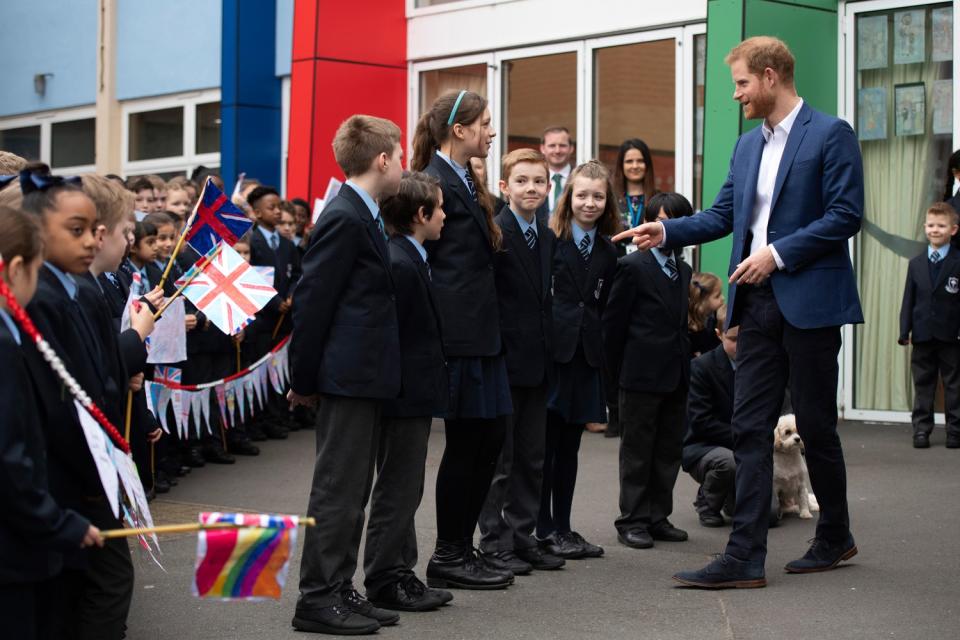 He joked with children on the visit to the school in Acton (EPA)