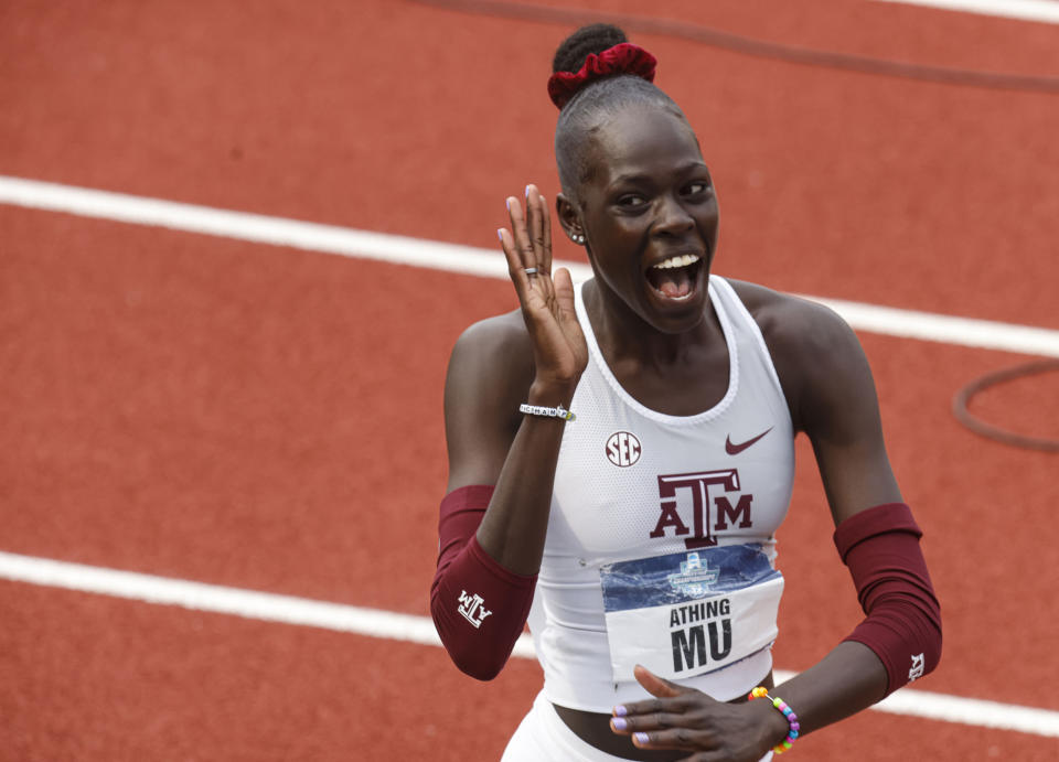 Texas A&M's Athing Mu celebrates after winning her heat of the women's 400 meters during the NCAA Division I Outdoor Track and Field Championships, Thursday, June 10, 2021, at Hayward Field in Eugene, Ore. (AP Photo/Thomas Boyd)