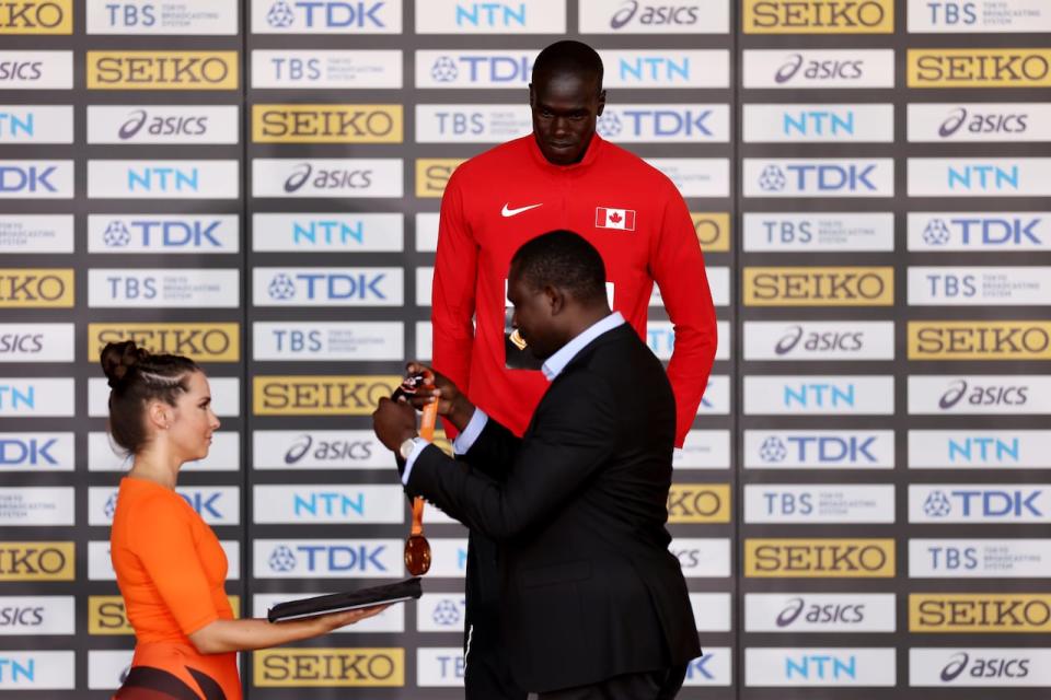 Canada's Marco Arop, pictured receiving his 2023 world championship gold medal, opened his outdoor 800-metre campaign Saturday with a win at the Diamond League season opener in Xiamen, China. (Christian Petersen/Getty Images for World Athletics - image credit)