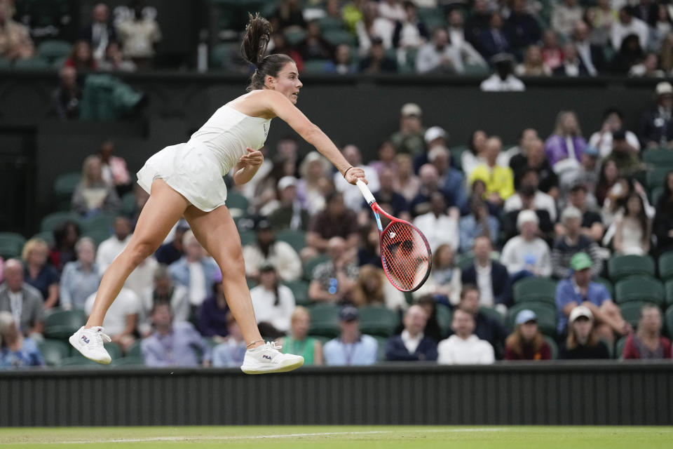 Emma Navarro of the United States serves to compatriot Coco Gauff during their fourth round match at the Wimbledon tennis championships in London, Sunday, July 7, 2024. (AP Photo/Alberto Pezzali)