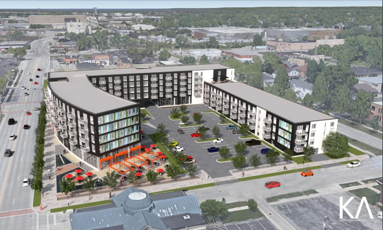 A rendering looking north of a mixed-use building that would add 172 apartments and a first-floor grocery store to downtown Green Bay. Currently, the site is a parking lot.