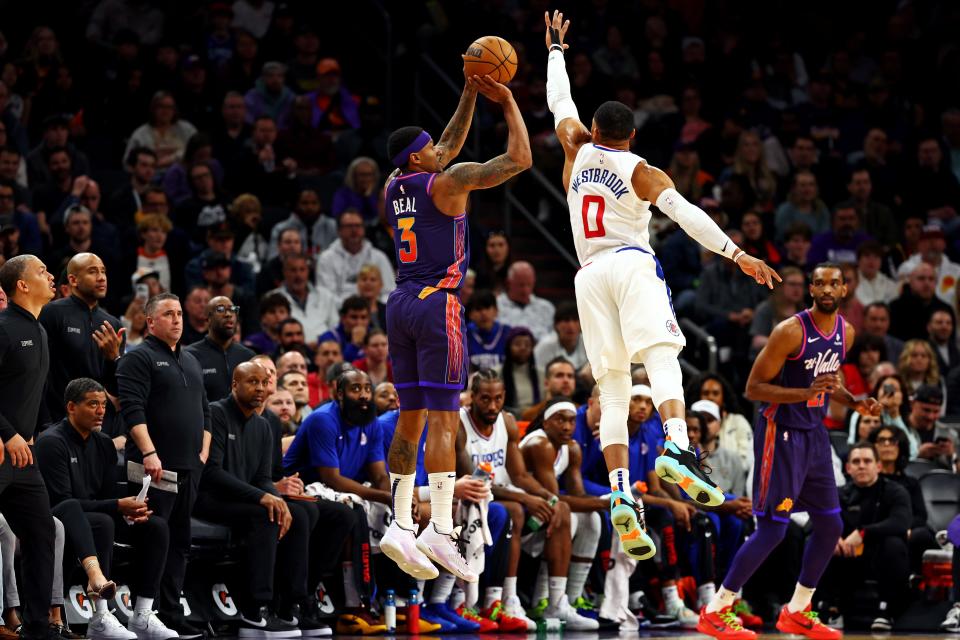 Phoenix Suns guard Bradley Beal (3) shoots the ball against LA Clippers guard Russell Westbrook (0) during the second quarter at Footprint Center in Phoenix on Jan. 3, 2024.