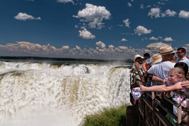 A viewing platform at Iguazu Falls. Photo: Joshua Paul Shefman/Flickr - Brazil has about 20 percent of the falls while the balance 80 percent belongs to Argentina. There are numerous falls and walkways that you can see but you cannot leave without seeing the Devil’s Throat, the point where the falls are at their highest and deepest.