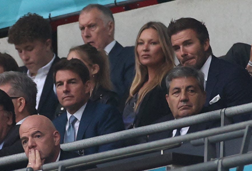 Tom Cruise (C-L) and English footballer David Beckham (C-R) are seen during the UEFA EURO 2020 final football match between Italy and England at the Wembley Stadium in London.