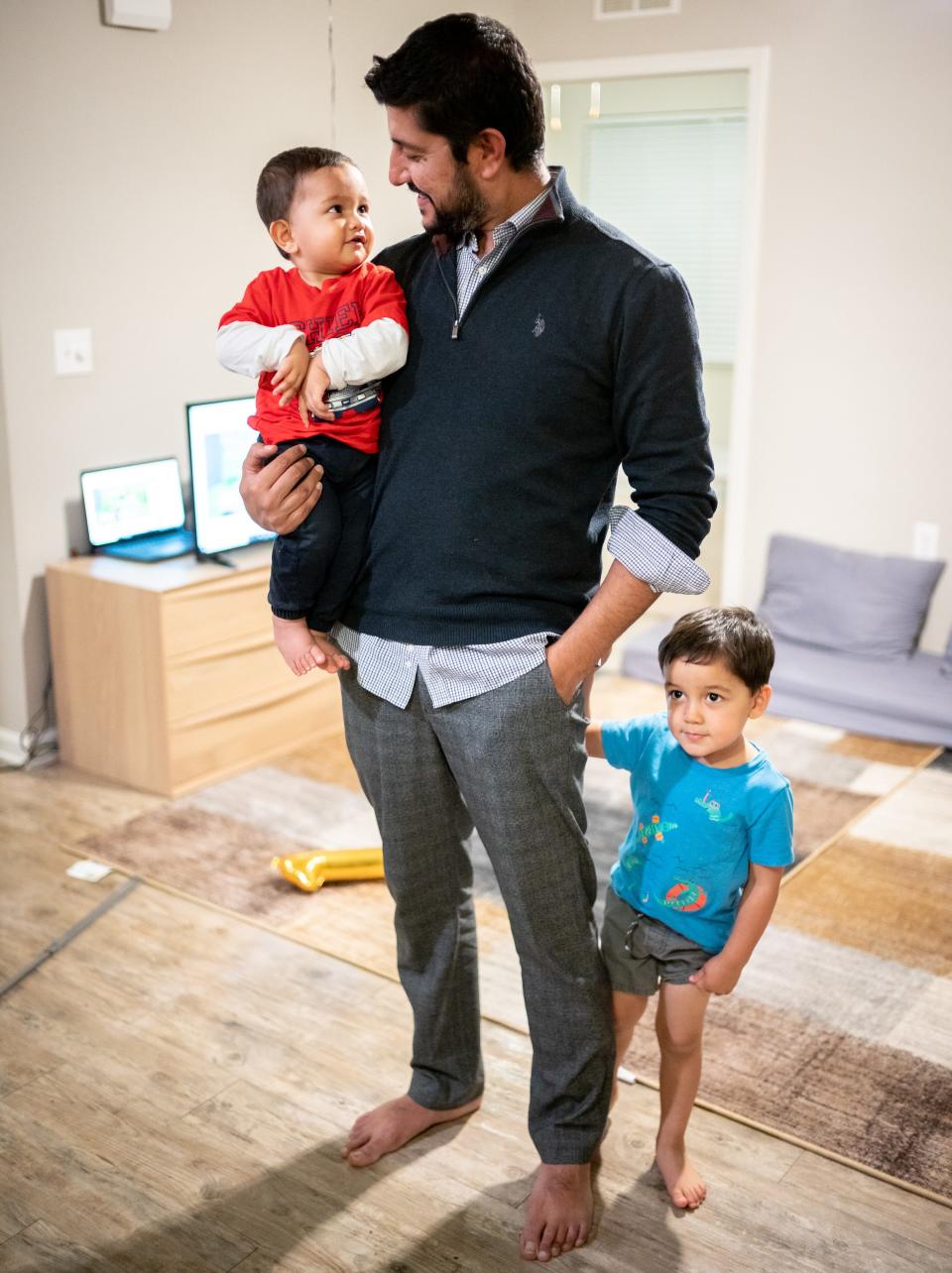 Rafi Sherzad spends time with his sons, Khushal Sherzad, left, 1, and Abdaal Sherzad, right, 3, at his apartment in Nashville on Dec. 21, 2021. Sherzad, a former Nashville resident, left Afghanistan with several relatives last year to escape the Taliban.