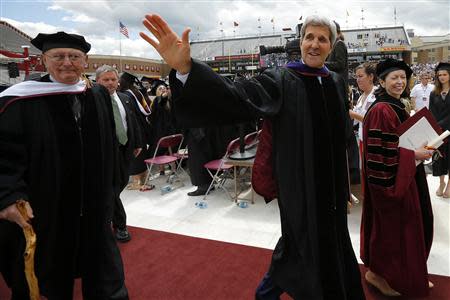 U.S. Secretary of State John Kerry waves after receiving an honorary Doctor of Laws degree and delivering the Commencement Address during Commencement Exercises at Boston College in Boston, Massachusetts May 19, 2014. REUTERS/Brian Snyder