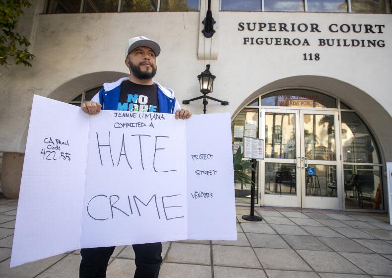 SANTA BARBARA, CA-NOVEMBER 30, 2023:Activist Edin Alex Enamorado, protests outside of Santa Barbara Superior Court during the arraignment for Jeanne Umana, a woman caught on two separate videos, using racist language to Latino men. Enamorado wants her to be charged with a hate crime. Her arraignment was continued until January 3, 2024. (Mel Melcon / Los Angeles Times)