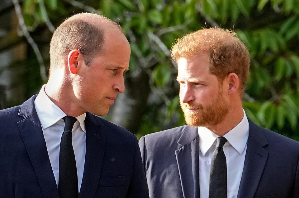 In this file photo, Prince William and Prince Harry walk beside each other after viewing the floral tributes for the late Queen Elizabeth II outside Windsor Castle, in Windsor, England, on Sept. 10, 2022.