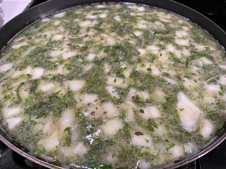 The ingredients for Ree Drummond's stuffing simmering together