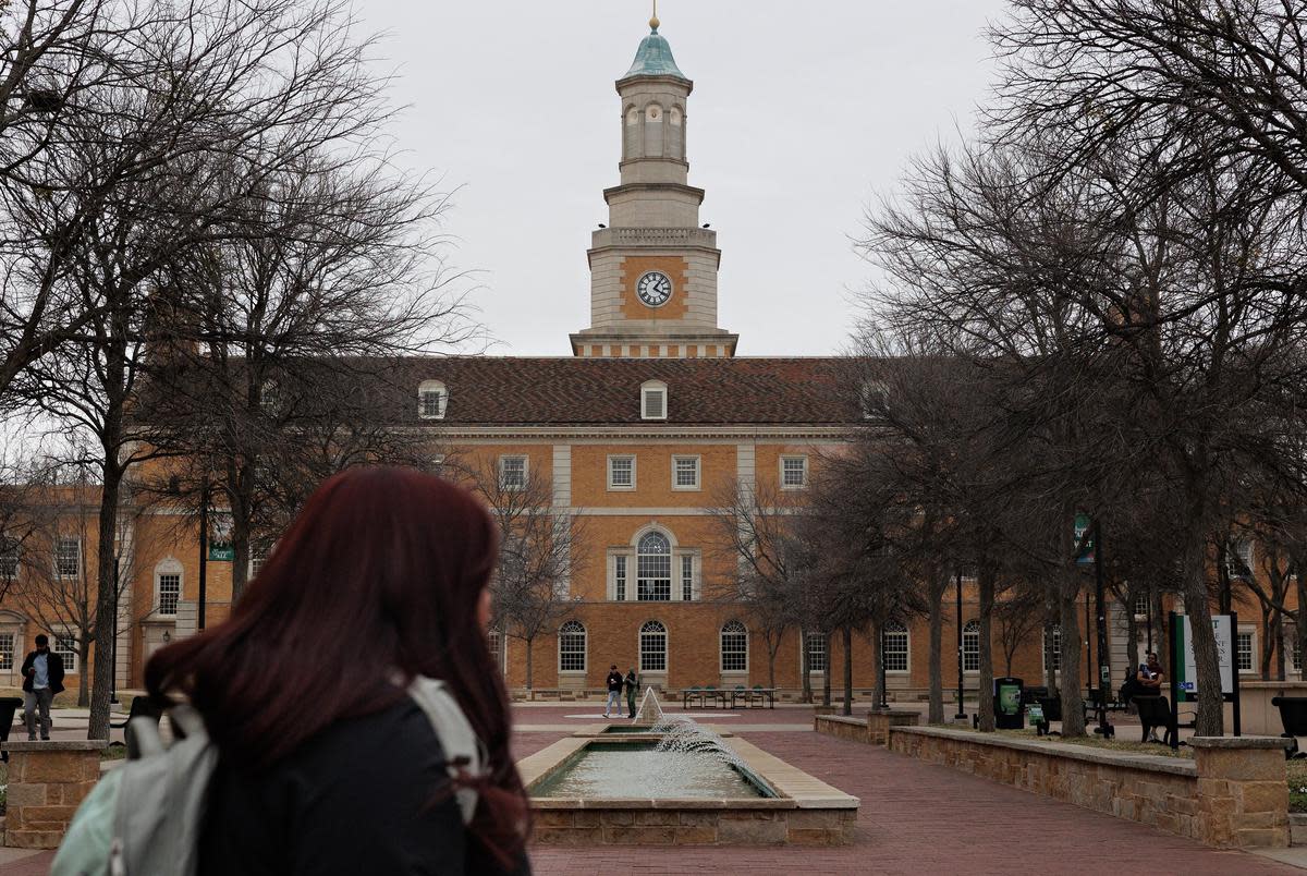Students walk the University of North Texas campus in Denton, TX on February 24, 2022.