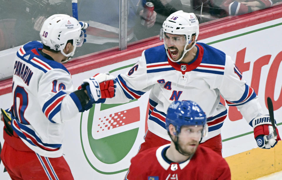 New York Rangers' Artemi Panarin (10) celebrates with teammate Vincent Trocheck (16) after scoring against the Montreal Canadiens during the second period of an NHL hockey game, Saturday, Jan. 6, 2024 in Montreal. (Graham Hughes/The Canadian Press via AP)