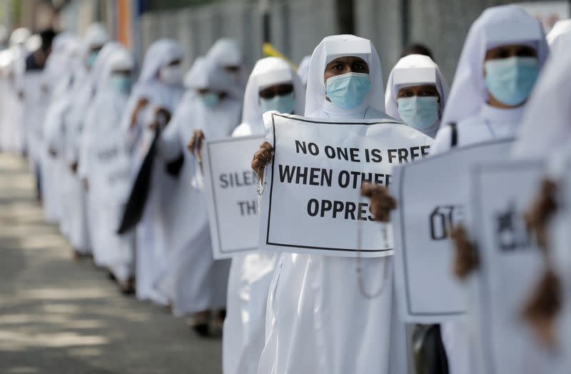 Catholic nuns hold placards against Sri Lanka's President Rajapaksa in Colombo