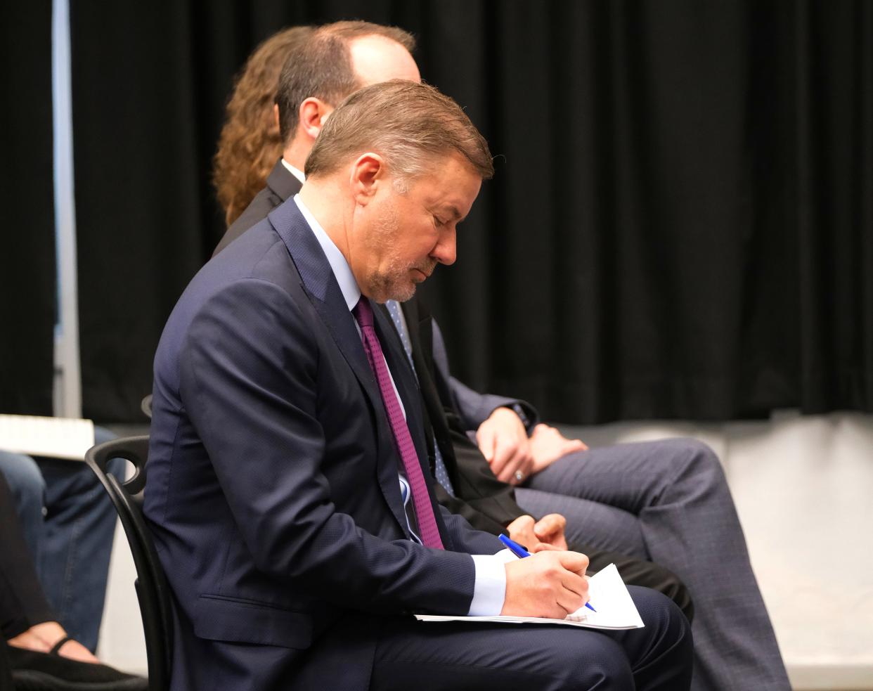 Oklahoma Attorney General Gentner Drummond takes notes during an Oklahoma Pardon and Parole Board clemency hearing for Richard Glossip in April 2023.