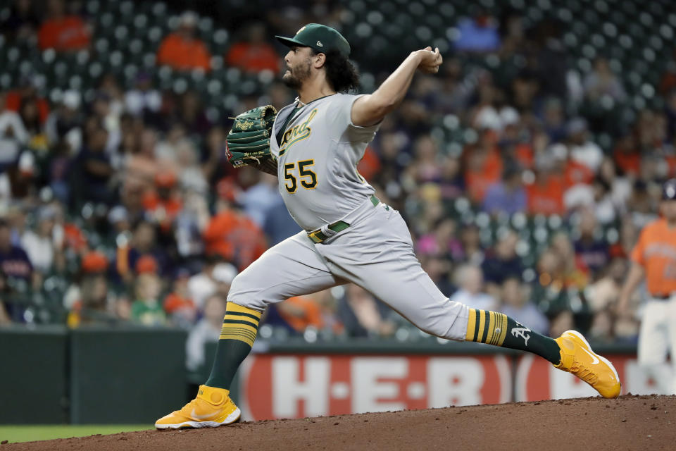 Oakland Athletics starting pitcher Sean Manaea (55) throws against the Houston Astros during the first inning of a baseball game Friday, Oct. 1, 2021, in Houston. (AP Photo/Michael Wyke)