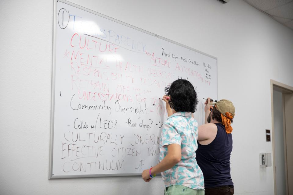 Ideas discussed in breakout rooms are written down on a whiteboard during NM CAFé's A Discussion: Police Reform and Accountability event at Thomas Branigan Memorial Library on Tuesday, June 7, 2022.