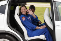 SpaceX Crew 2 member NASA astronaut Megan McArthur, front, waves as she leaves a news conference with NASA astronaut Shane Kimbrough, back, at the Kennedy Space Center in Cape Canaveral, Fla., Friday, April 16, 2021 as they prepare for a mission to the International Space Station. The launch is targeted for April 22. (AP Photo/John Raoux)