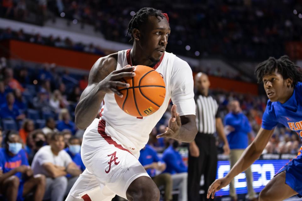 Jan 5, 2022; Gainesville, Florida, USA; Alabama Crimson Tide forward Juwan Gary (4) dribbles the ball during the first half against the Florida Gators at Billy Donovan Court at Exactech Arena. Mandatory Credit: Matt Pendleton-USA TODAY Sports