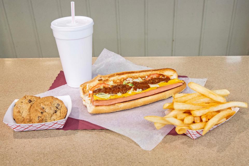 The chocolate chip cookies, lemonade, cheese dog with chili and fries are featured at the landmark restaurant The Dog House near New Castle, Thursday, Dec. 7, 2023. The Dog House has been serving hot dogs since 1952 and under new ownership has a new breakfast menu.