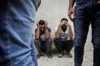 Relatives of Palestinian Zaki Ghanama, 25, mourn in the morgue of a hospital in Beit Lahia in the northern Gaza Strip