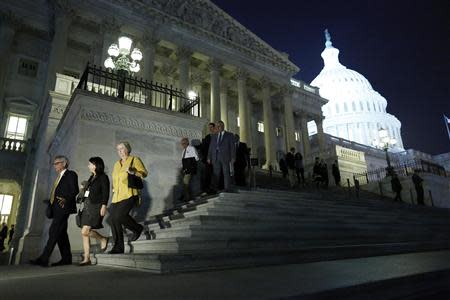 Members of the U.S. House of Representatives depart after a late-night vote on fiscal legislation to end the government shutdown, at the U.S. Capitol in Washington, October 16, 2013. REUTERS/Jonathan Ernst