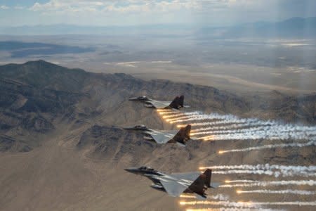 FILE PHOTO: Three U.S. Air Force F-15E Strike Eagles,  from Mountain Home Air Force Base, Idaho, fire flares over the Utah Test and Training Range, west of Salt Lake CIty in Utah, U.S., July 3, 2018.   U.S. Air Force/Airman 1st Class Codie Trimble/Handout via REUTERS