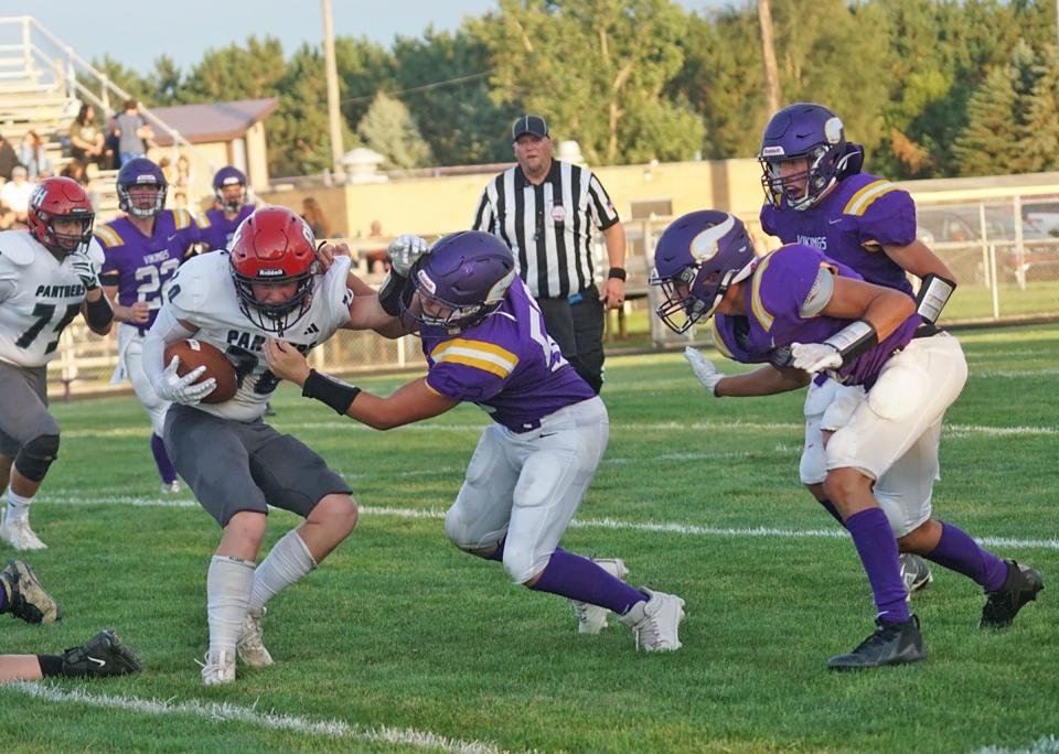 The Bronson defense converge on a Prairie Heights runner Friday night.