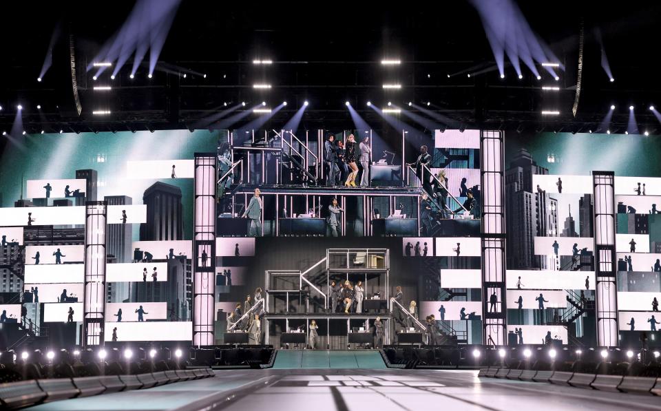 During “The Man,” Swift uses scaffolding and office props to emulate a corporate environment.