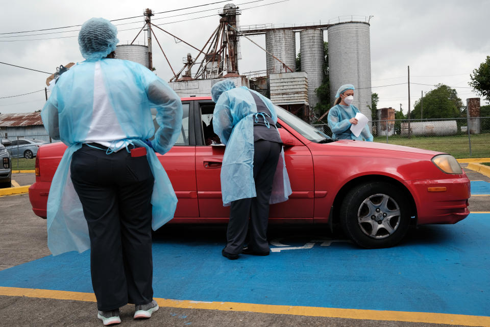 Medical workers with Delta Health Center prepare to vaccinate people at a pop-up COVID-19 vaccination clinic in a rural Delta community on April 29, 2021 in Leland, Mississippi. (Spencer Platt/Getty Images)