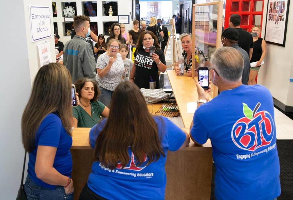 Anti-mask protesters clash with members of the Broward Teachers Union on Tuesday, July 27, 2021, in the Kathleen C. Wright Administration Building. The group was there to speak against students wearing masks when classes resume. They became angered when the meeting was postponed until Wednesday.