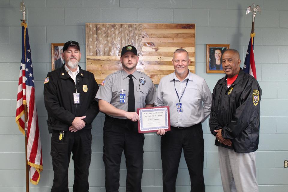 Major Sean Frizzell, Correction Officer of the Year Robert Tipton, Warden Jay Forshey, and Deputy Warden Michael Wicker at the presentation of Tipton's award