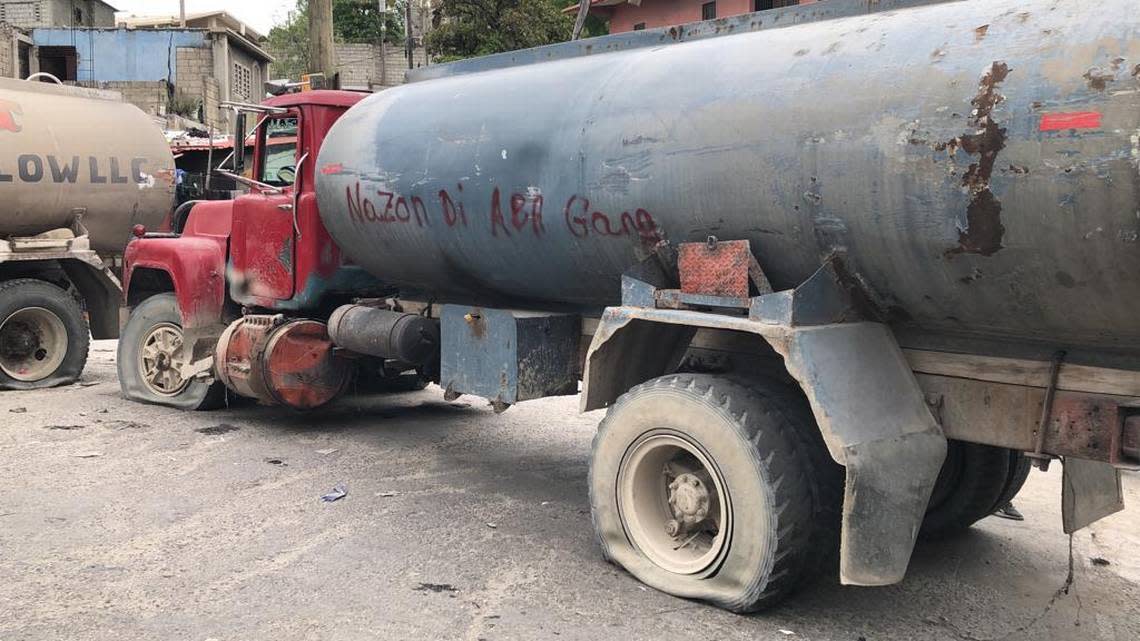 After an angry crowd in a Port-au-Prince neighborhood killed 13 suspected gang members on Monday, April 24, residents in the capital began erecting barricades from whatever they can find to protect themselves from encroaching, menacing gangs. This truck reads, “Nazon says down with gangs.”
