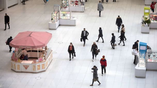 PHOTO: In this March 10, 2022, file photo, people walk in a shopping mall in New York. (Xinhua News Agency via Getty Images, FILE)