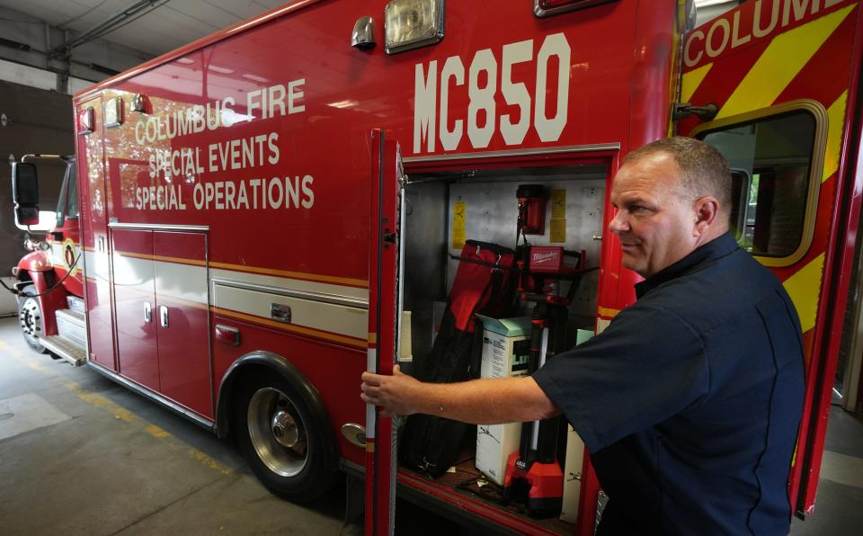 Columbus Division of Fire Capt. Aaron Renner opens one of the compartments on the special mass casualty ambulance, MC580, that is kept at city fire station #1 Downtown.