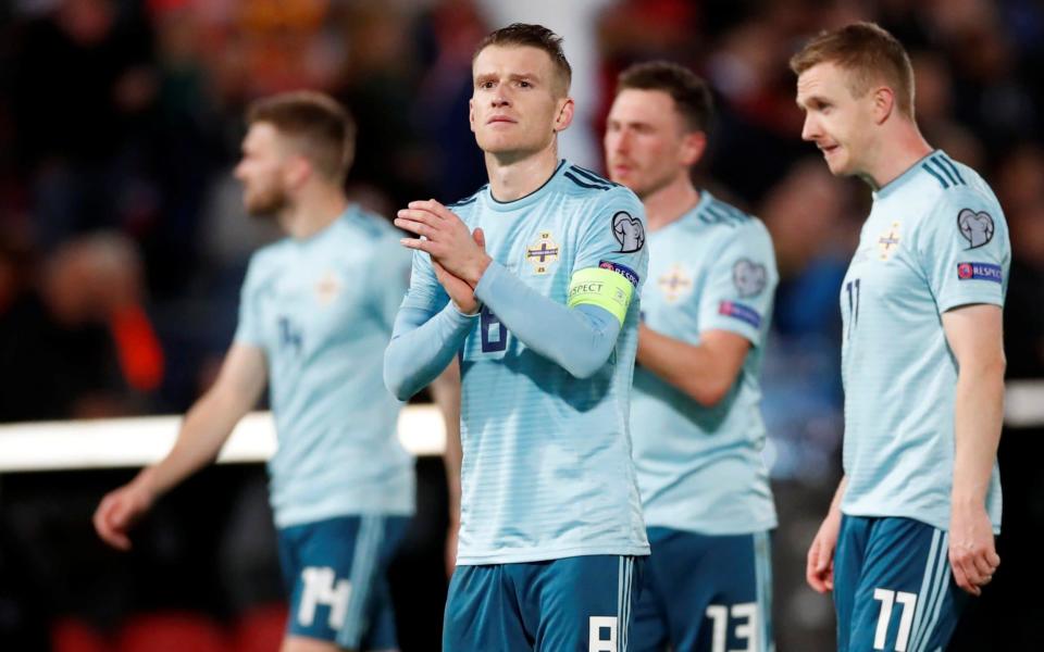 Steven Davis applauds the travelling fans after Northern Ireland's 3-1 defeat in Rotterdam - Action Images via Reuters