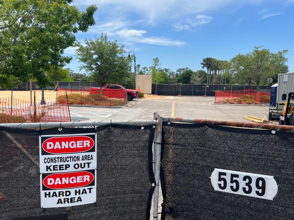 A construction fence surrounds the site of the former Chuck E. Cheese pizza restaurant/family fun arcade at The Pavilion at Port Orange shopping center, pictured Monday, April 15, 2024. A building permit has been issued for a new Chuck E. Cheese restaurant that will be slightly bigger than the one that was torn down after Hurricane Ian in 2022. It is expected to open by the end of 2024, according to City officials.