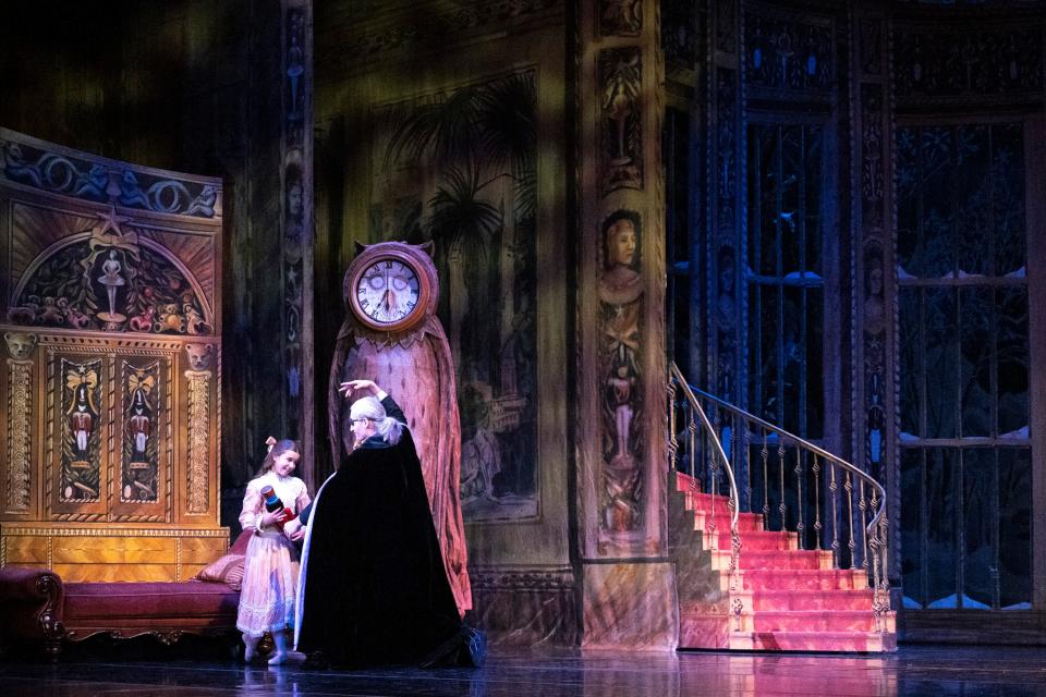 Young Clara, played by Chloe Steele, and Herr Drosselmeyer, played by Austin Powers, smile at one another during a preview rehearsal for BalletMet’s performance of "The Nutcracker" at the Ohio Theatre.
