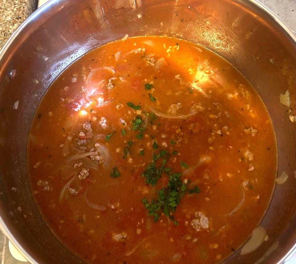 Adding parsley to broth for Pioneer Woman's Lasagna Soup