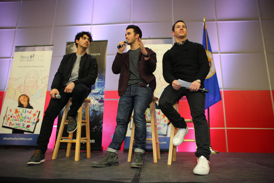 MINNEAPOLIS, MN - FEBRUARY 06: (L-R) Joe Jonas, Kevin Jonas and Nick Jonas of the musical trio the Jonas Brothers surprise 600 students at Minneapolis Patrick Henry High School to launch 'We Day' on February 6, 2013 in Minneapolis, Minnesota.  (Photo by Adam Bettcher/Getty Images for Free The Children)