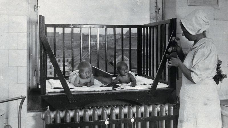 Babies in a hospital cot at the University Children’s Hospital, Vienna. Photograph, 1921.