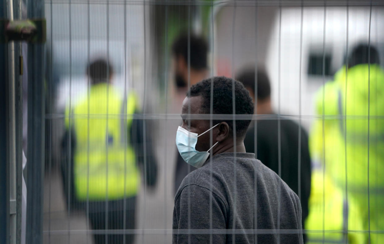 A man thought to be a migrant at the Manston immigration short-term holding facility located at the former Defence Fire Training and Development Centre in Thanet, Kent. Picture date: Monday November 7, 2022.