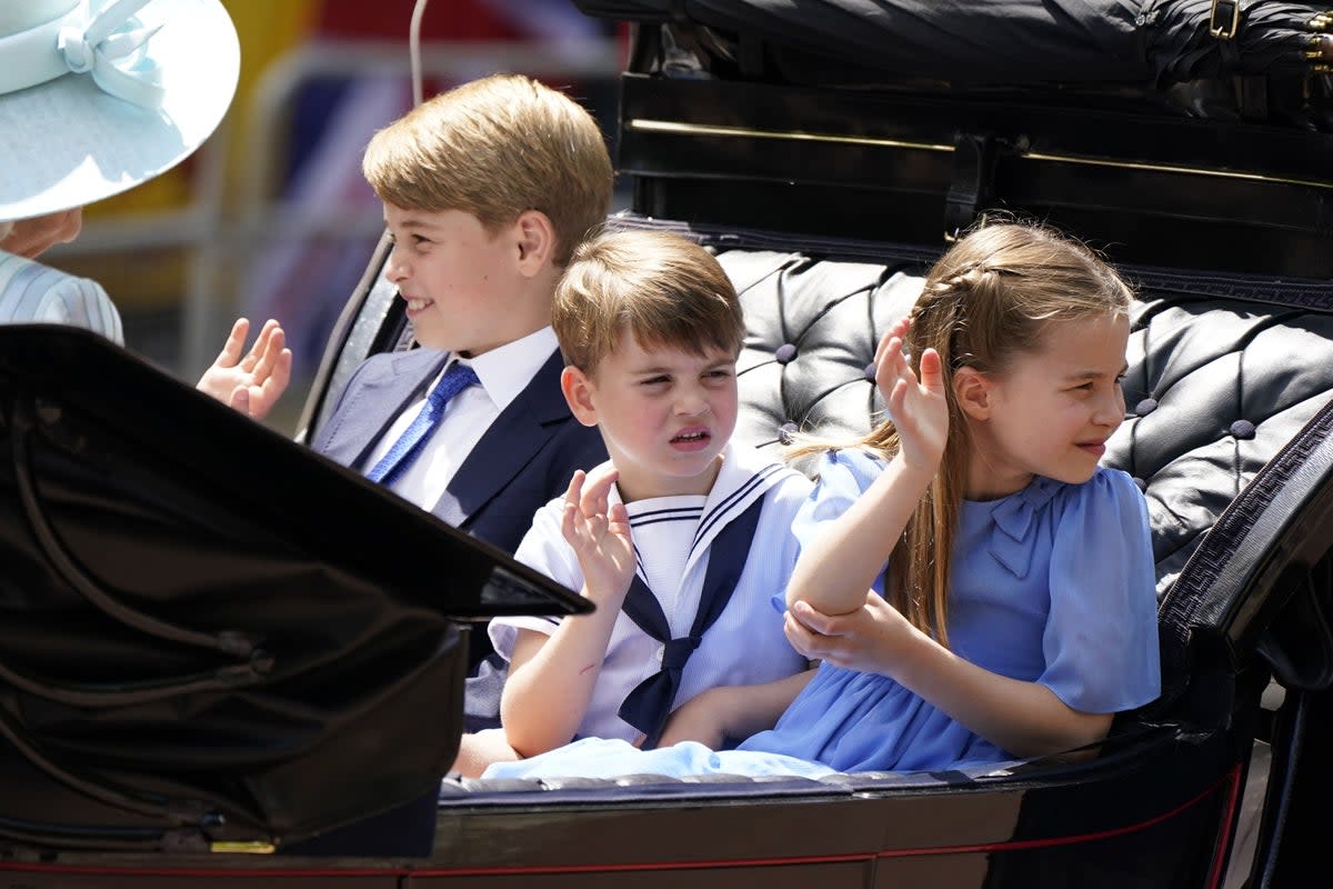 Prince George, Prince Louis and Princess Charlotte wave to crowds as they ride in a carriage during the Queen’s Platinum Jubilee celebrations in 2022 (PA) (PA Archive)