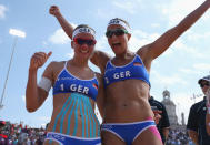 LONDON, ENGLAND - JULY 28: Katrin Holtwick (L) and Ilka Semmler of Germany celebrate their victory in the Women's Beach Volleyball match between Germany and Czech Republic on Day 1 of the London 2012 Olympic Games at Horse Guards Parade on July 28, 2012 in London, England. (Photo by Alexander Hassenstein/Getty Images)