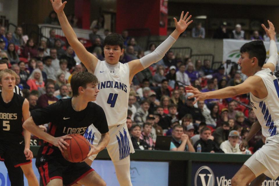 Jayden Yankton (center, white) and Jacolby Pearson (right, white) committed to United Tribes Technical College and Bismarck State College, respectively.