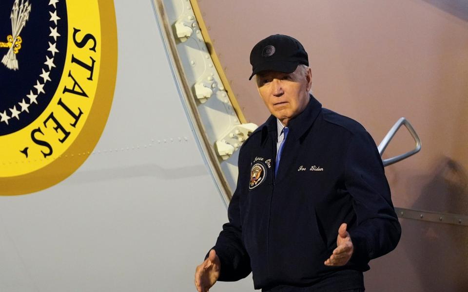 President Joe Biden walks down the steps of Air Force One at Dover Air Force Base in Delaware on Wednesday