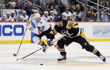 Oct 11, 2018; Pittsburgh, PA, USA; Pittsburgh Penguins right wing Phil Kessel (81) skates up ice on a breakaway ahead of Vegas Golden Knights defenseman Brayden McNabb (3) during the second period at PPG PAINTS Arena. Mandatory Credit: Charles LeClaire-USA TODAY Sports