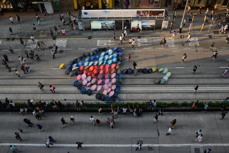 An art installation featuring a giant umbrella made up of umbrellas, on a road occupied by pro-democracy protesters in the Causeway Bay district of Hong Kong on October 11, 2014