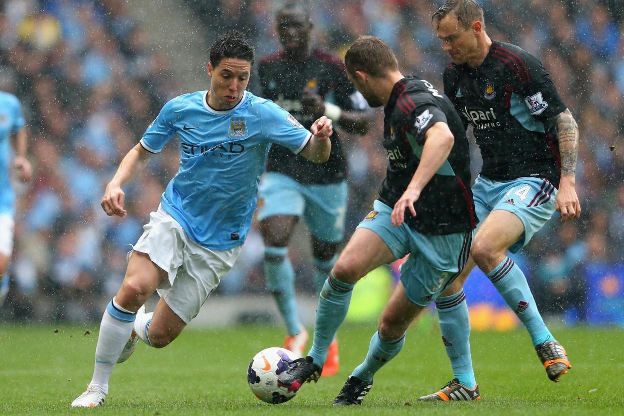 Running man: Samir Nasri in action for Manchester City against West Ham in 2014: Getty Images