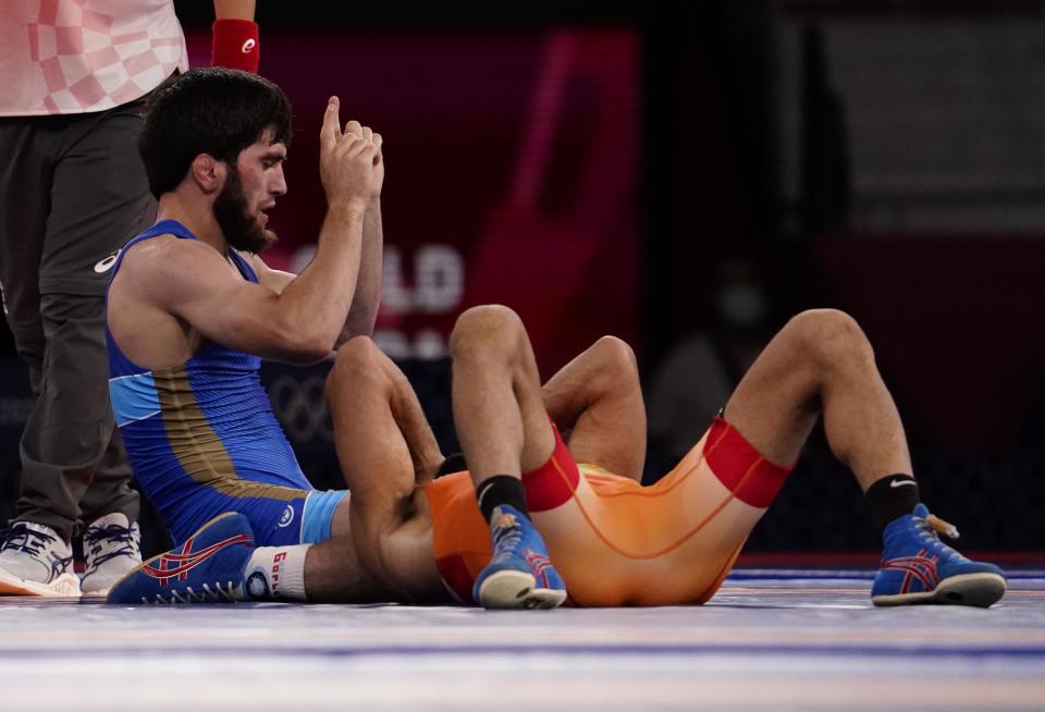 Aug 5, 2021; Chiba, Japan;  Zavur Uguev (ROC) defeats Kumar Ravi (IND) in the men's freestyle 57kg final during the Tokyo 2020 Olympic Summer Games at Makuhari Messe Hall A. Mandatory Credit: Mandi Wright-USA TODAY Sports