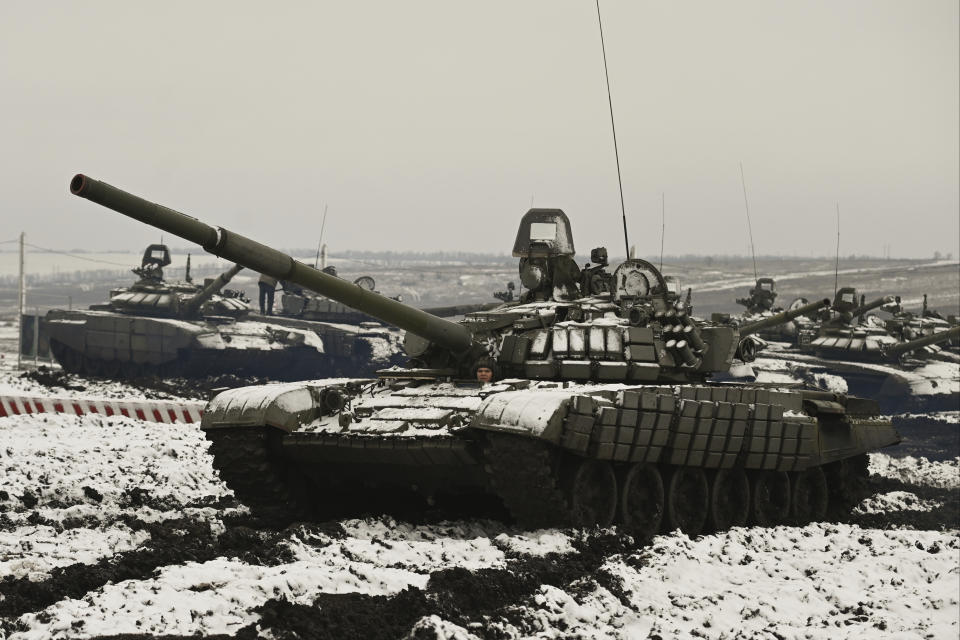 Russian tanks T-72B3 take part in drills at the Kadamovskiy firing range in the Rostov region in southern Russia, Wednesday, Jan. 12, 2022. Russia has rejected Western complaints about its troop buildup near Ukraine, saying it deploys them wherever it deems necessary on its own territory. (AP Photo)